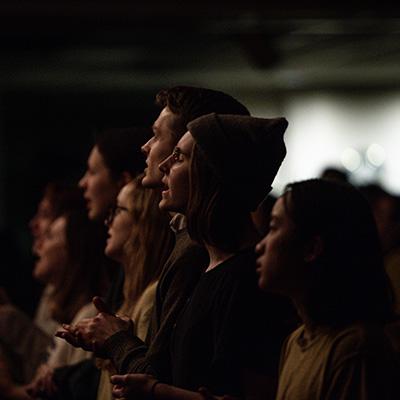 Students participating in a worship service on campus